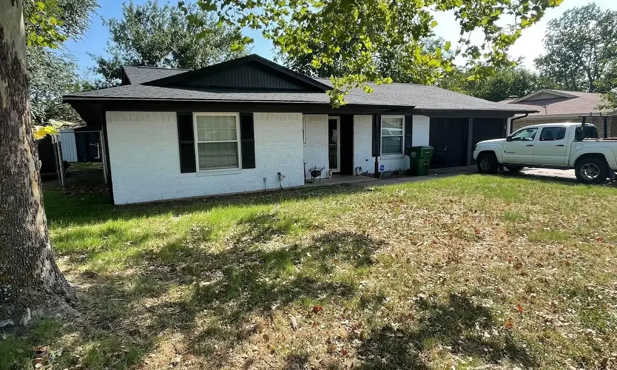 Professional roofing crew working on a residential roof in Brown Deer
